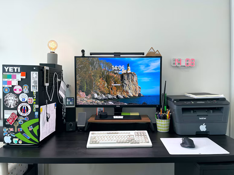 Home office workstation with a desktop computer, monitor, keyboard, mouse and multifunction printer